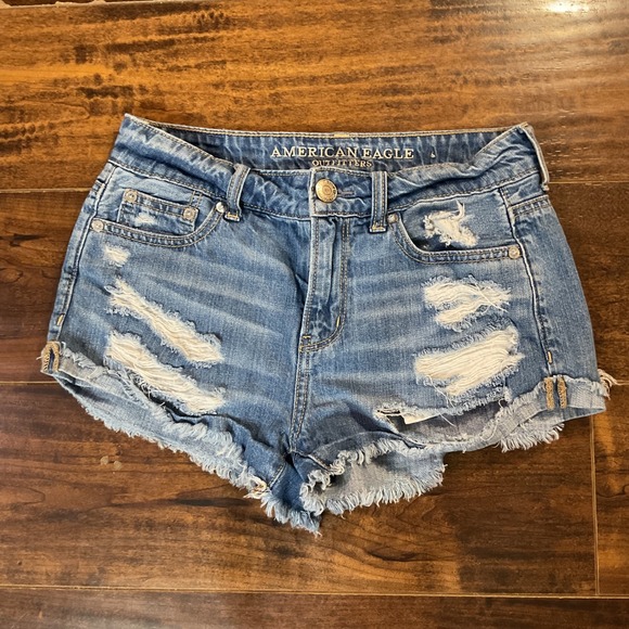 American Eagle Outfitters Pants - American Eagle Tomgirl Shortie Distressed Denim Shorts Medium Wash Blue Size 00